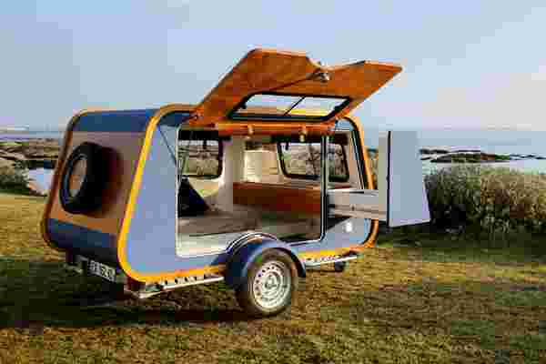 This retro nautical-inspired teardrop caravan adds a dash of luxury to your camping experience!